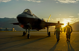 Two Airmen at sunset with F-35 Two Airmen at sunset with F-35