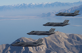 Four F-35s in midair formation Four F-35s in midair formation